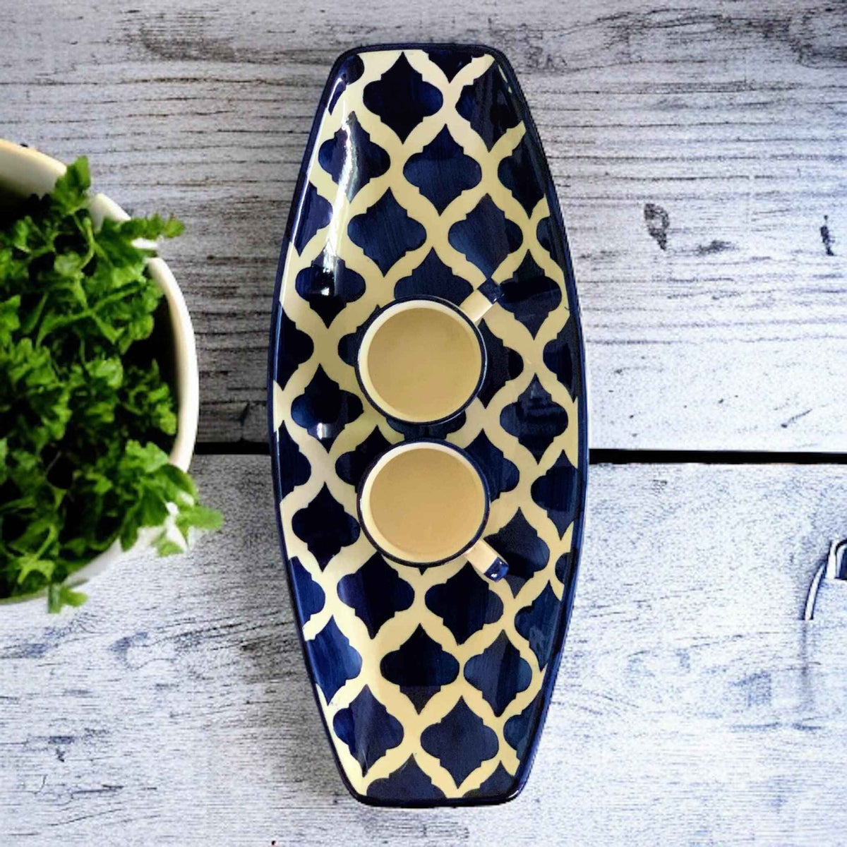 Blue ceramic serving platter with two dip bowls